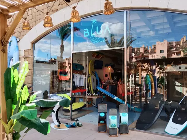 The front exterior of the Blua Blue surf shop by day.