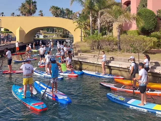 A large gathering of paddleboard, or SUP, riders in the Sotogrande port.
